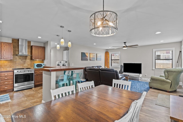151 NE 9th St, Oak Island, NC 28465 - dining room featuring plenty of natural light, ceiling fan, recessed lighting, and washer / clothes dryer
