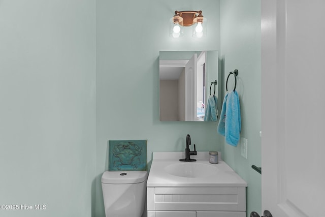 151 NE 9th St, Oak Island, NC 28465 - bathroom featuring vanity and toilet