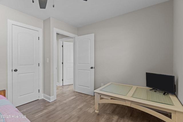 151 NE 9th St, Oak Island, NC 28465 - home office featuring light wood-style floors, a ceiling fan, and baseboards