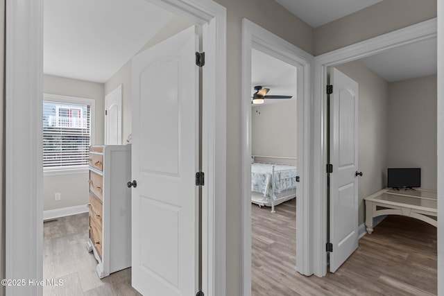 151 NE 9th St, Oak Island, NC 28465 - corridor featuring light wood-style flooring and baseboards