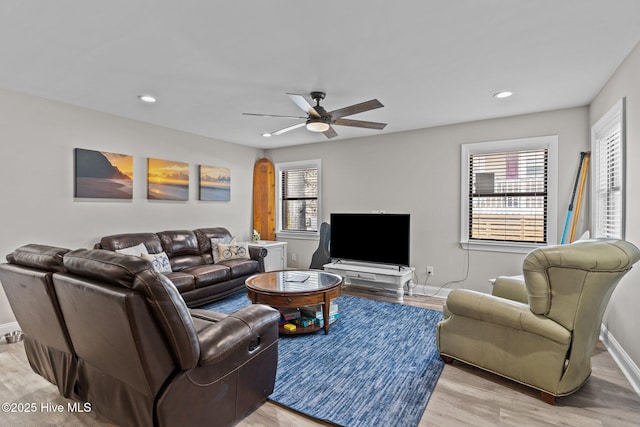 151 NE 9th St, Oak Island, NC 28465 - living room with healthy amount of natural light, light wood-style floors, ceiling fan, baseboards, and recessed lighting