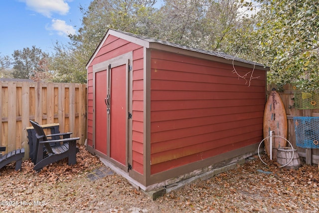 151 NE 9th St, Oak Island, NC 28465 - view of shed with a fenced backyard