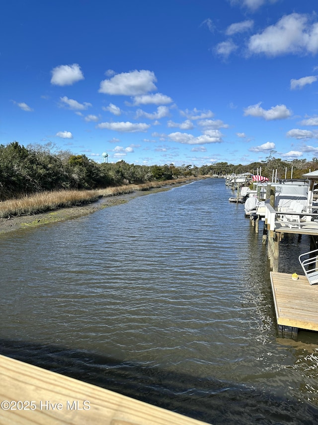 151 NE 9th St, Oak Island, NC 28465 - dock area featuring a water view
