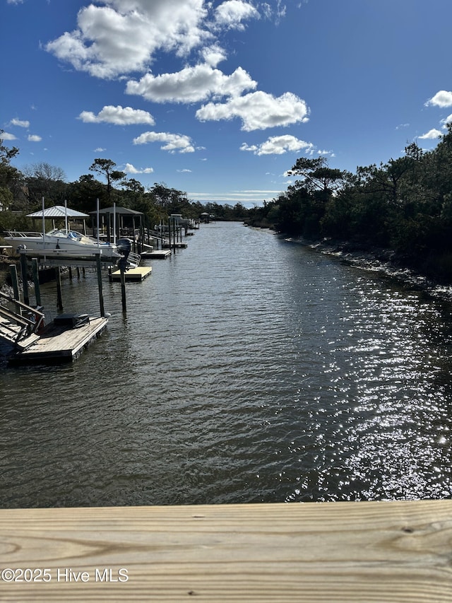 151 NE 9th St, Oak Island, NC 28465 - dock featuring a water view