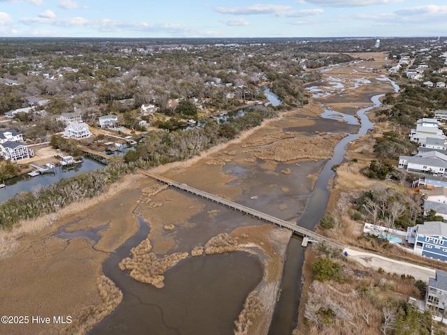 151 NE 9th St, Oak Island, NC 28465 - aerial view of property and surrounding area featuring a nearby body of water and nearby suburban area