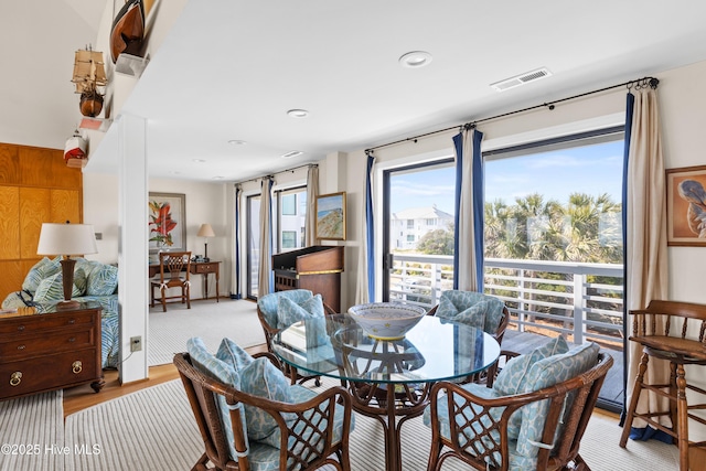 dining space featuring wood finished floors, visible vents, and recessed lighting