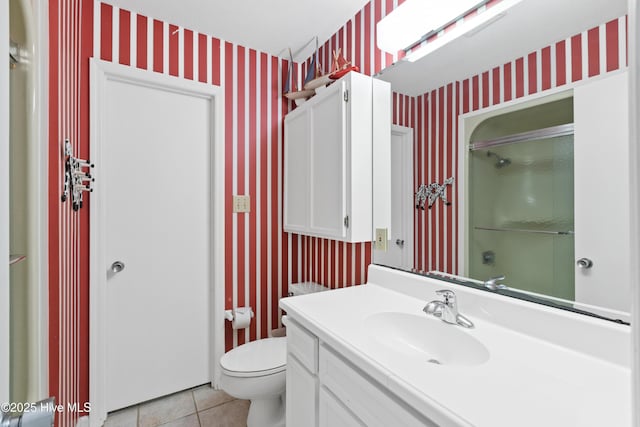 full bath featuring toilet, wallpapered walls, tile patterned flooring, and walk in shower