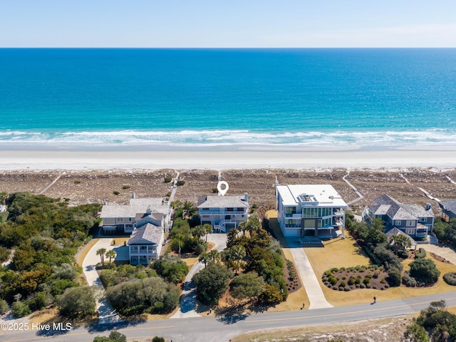 bird's eye view featuring a water view and a view of the beach