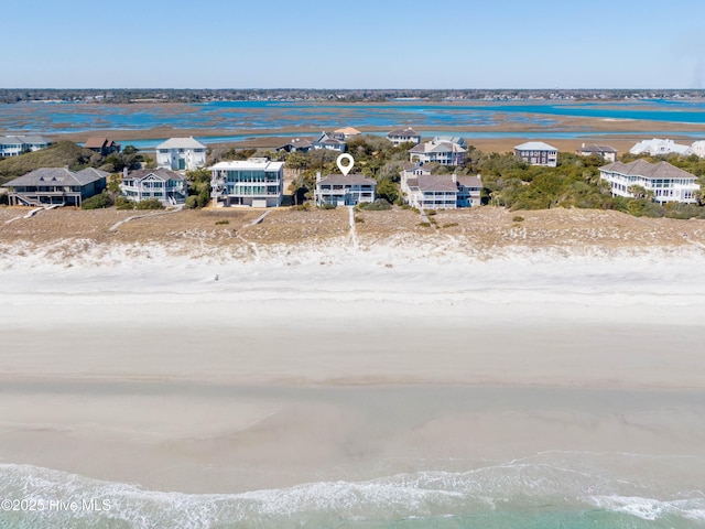 drone / aerial view featuring a water view and a residential view