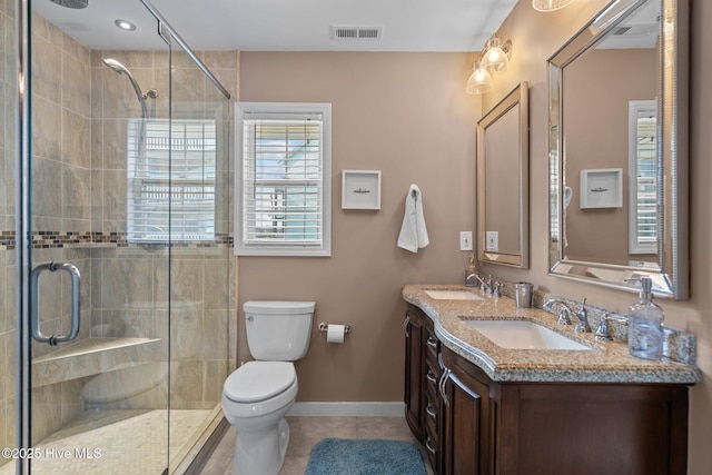 bathroom with visible vents, tile patterned flooring, a sink, and toilet