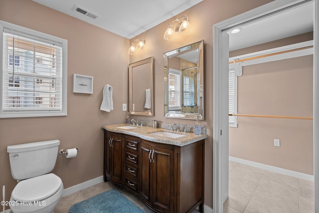 full bathroom featuring tile patterned flooring, visible vents, a sink, and toilet