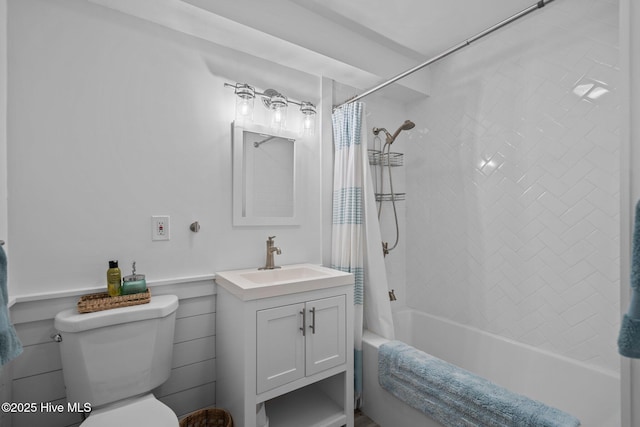 bathroom with shower / bath combo, vanity, and toilet