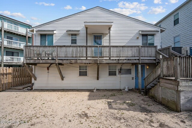 drone / aerial view featuring a water view and a view of the beach