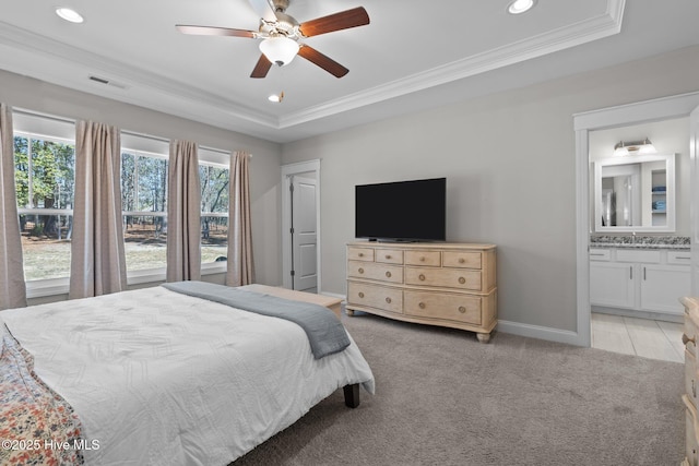 bedroom with visible vents, a raised ceiling, light colored carpet, ornamental molding, and recessed lighting