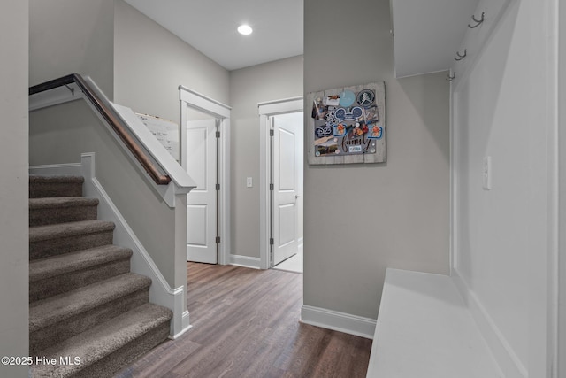 stairs featuring recessed lighting, baseboards, and wood finished floors