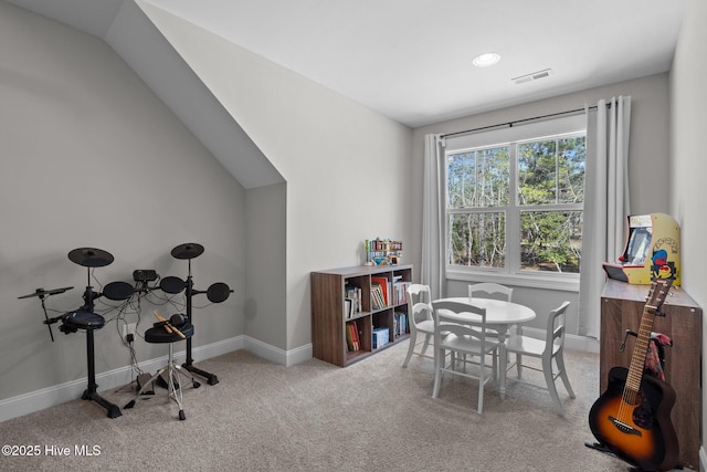 rec room with carpet, visible vents, vaulted ceiling, and baseboards