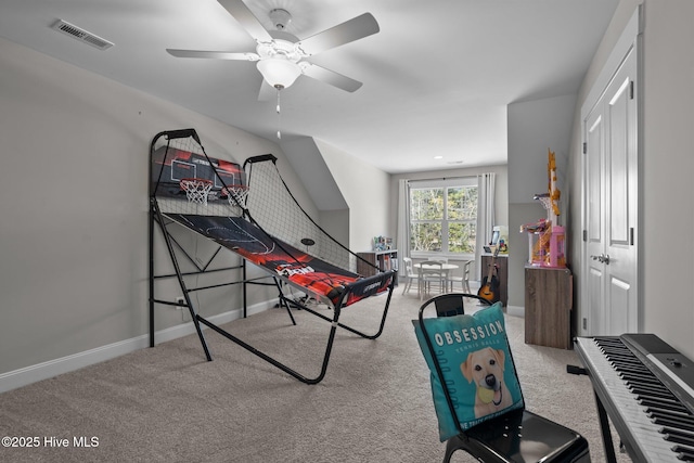 game room featuring a ceiling fan, carpet, visible vents, and baseboards