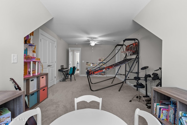 rec room with carpet, baseboards, and ceiling fan