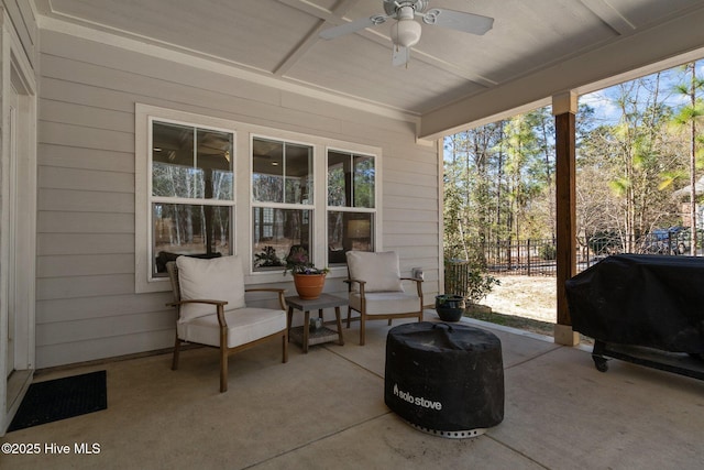 view of patio with a ceiling fan, a grill, and fence