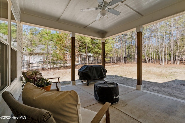 view of patio / terrace with a fenced backyard, ceiling fan, and grilling area