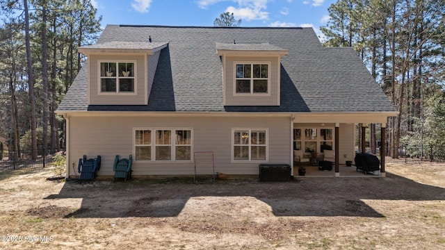 back of house with a patio, a shingled roof, and fence