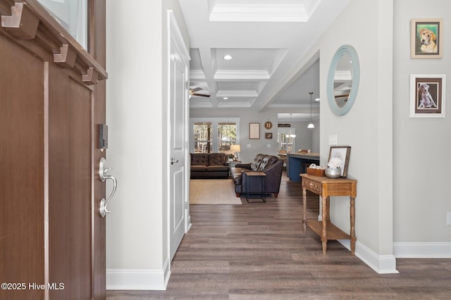 entryway with dark wood-style flooring, crown molding, coffered ceiling, beamed ceiling, and baseboards