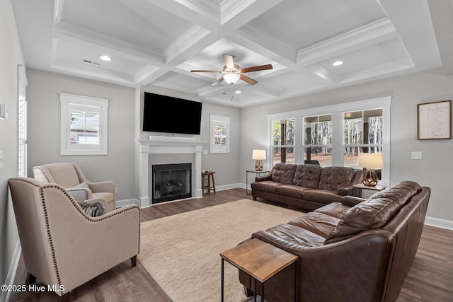 living room with baseboards and dark wood-type flooring