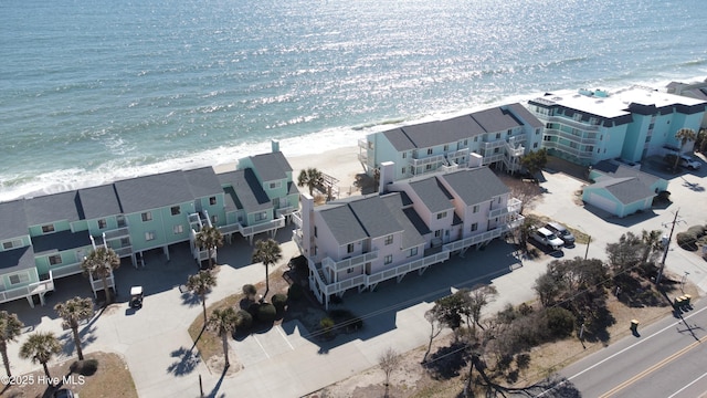 bird's eye view with a water view and a view of the beach