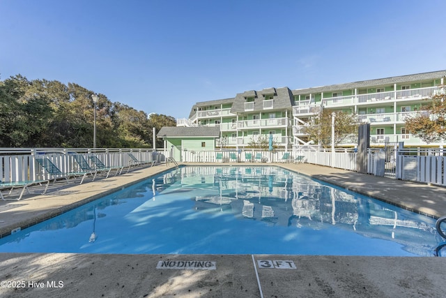 community pool with fence