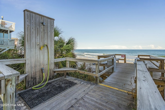 exterior space featuring a water view and a view of the beach