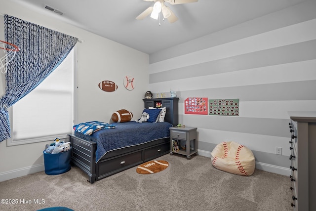 bedroom featuring ceiling fan, carpet flooring, visible vents, and baseboards