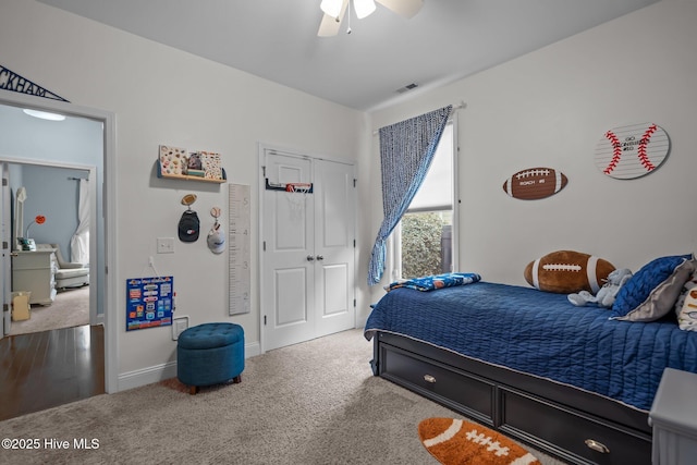 bedroom with carpet floors, a closet, visible vents, a ceiling fan, and baseboards