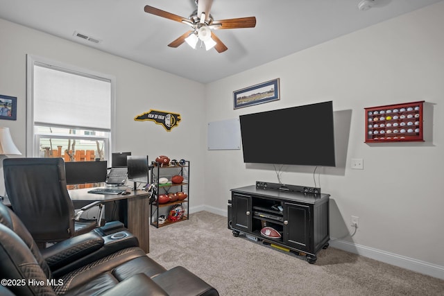 living room with baseboards, carpet, visible vents, and a ceiling fan