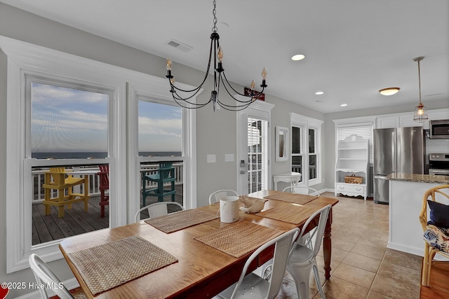 dining space featuring light tile patterned floors, visible vents, a notable chandelier, and recessed lighting