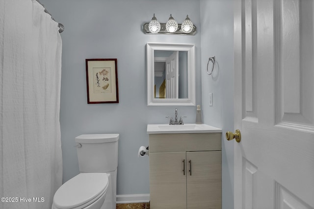 full bathroom featuring vanity and toilet