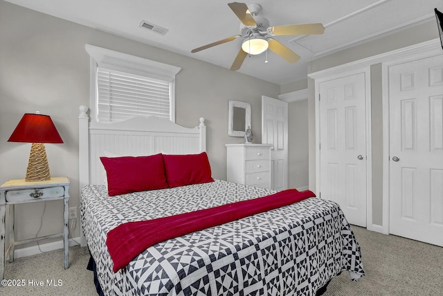 bedroom featuring a ceiling fan, visible vents, baseboards, and speckled floor