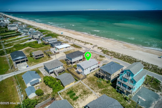 aerial view with a water view, a residential view, and a view of the beach