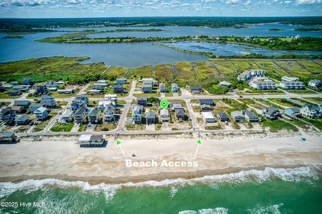 bird's eye view with a water view and a residential view