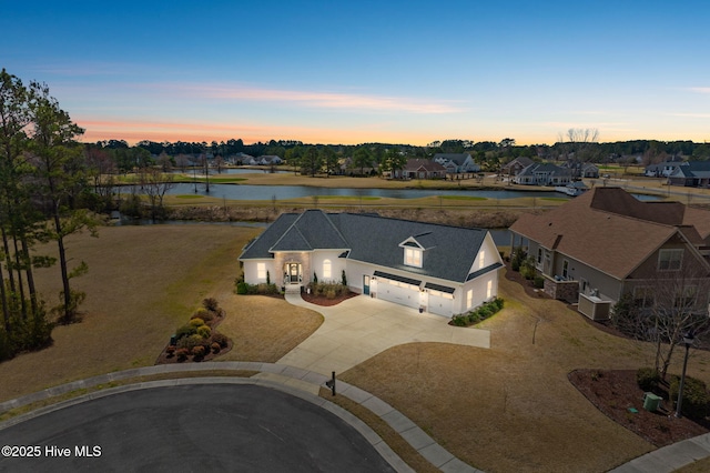 birds eye view of property with a residential view and a water view