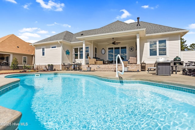 outdoor pool featuring an outdoor living space, fence, a ceiling fan, and a patio area