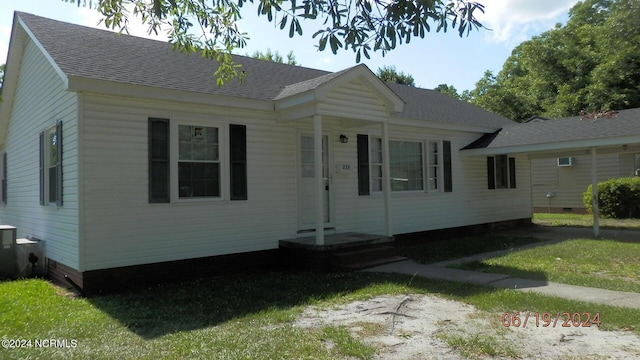 view of front of property featuring roof with shingles and crawl space