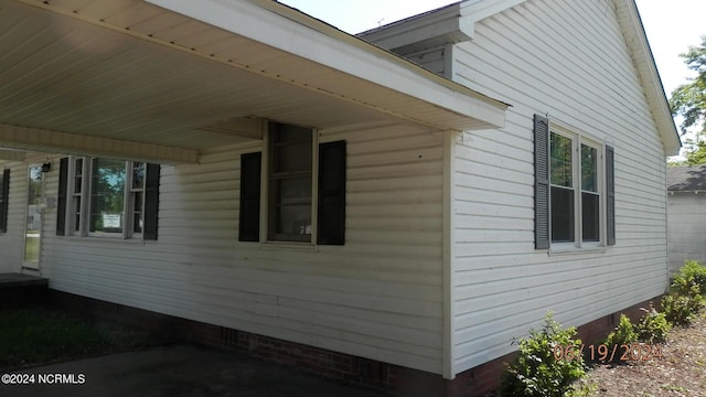 view of side of home with crawl space