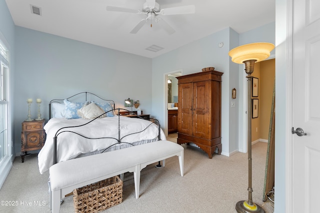 bedroom featuring ceiling fan, visible vents, baseboards, and light colored carpet