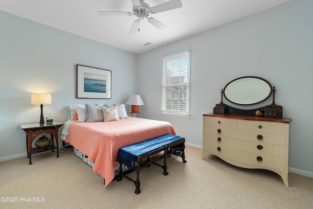 bedroom with light carpet, visible vents, baseboards, and a ceiling fan