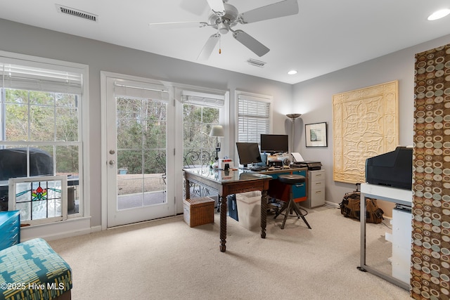 home office with recessed lighting, visible vents, a wealth of natural light, and carpet flooring