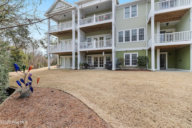 rear view of house featuring french doors