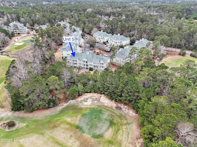 aerial view featuring a wooded view