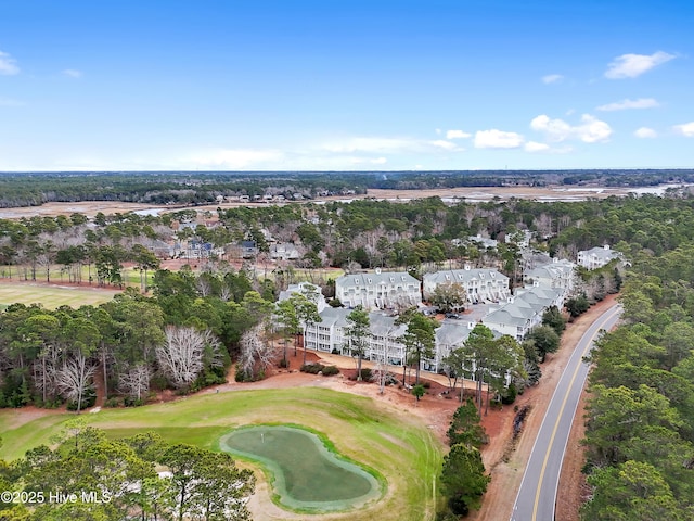 birds eye view of property with view of golf course