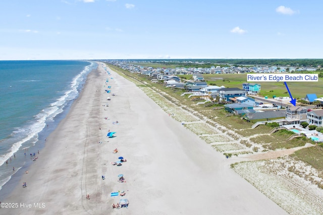 drone / aerial view with a view of the beach and a water view