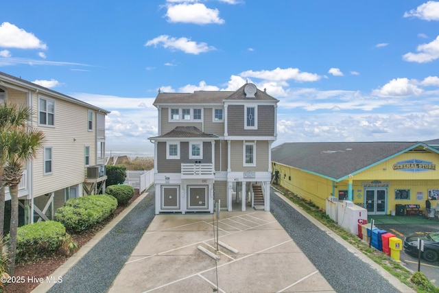 view of front of property with roof with shingles